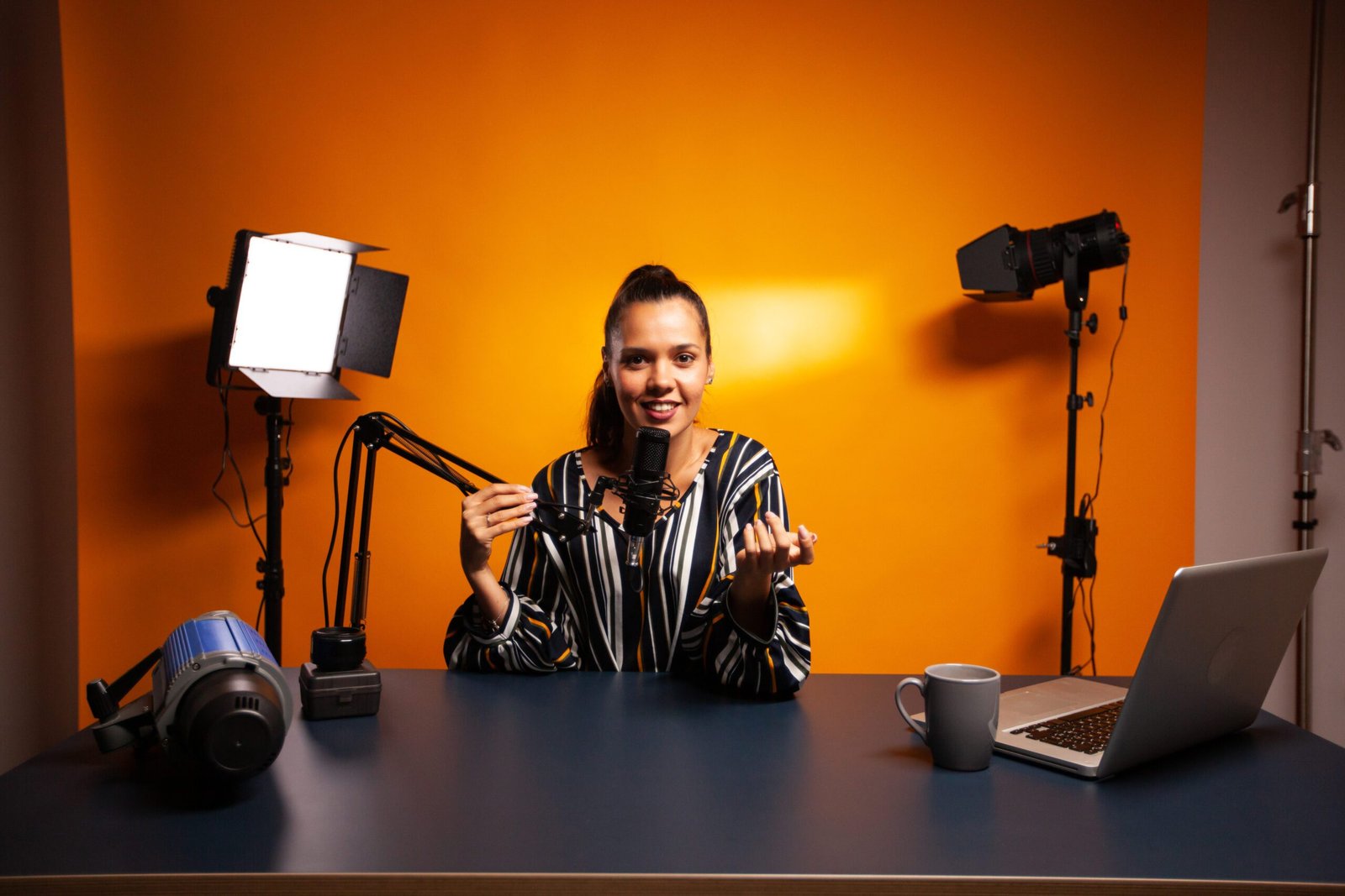 Female digital marketer recording TikTok marketing content with professional studio